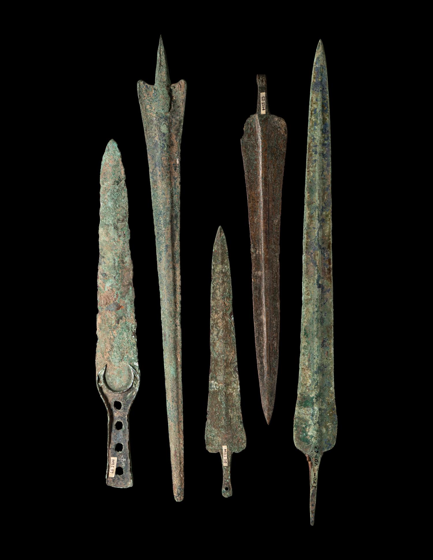 A Group of 5 Luristan Bronze Weapons Including Spearheads and a Sword
