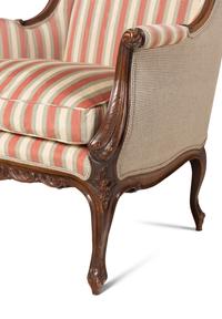 A Pair of Louis XV Style Carved Wingback Armchairs