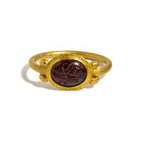 A Roman Gold and Garnet Finger Ring with the Goddess Minerva