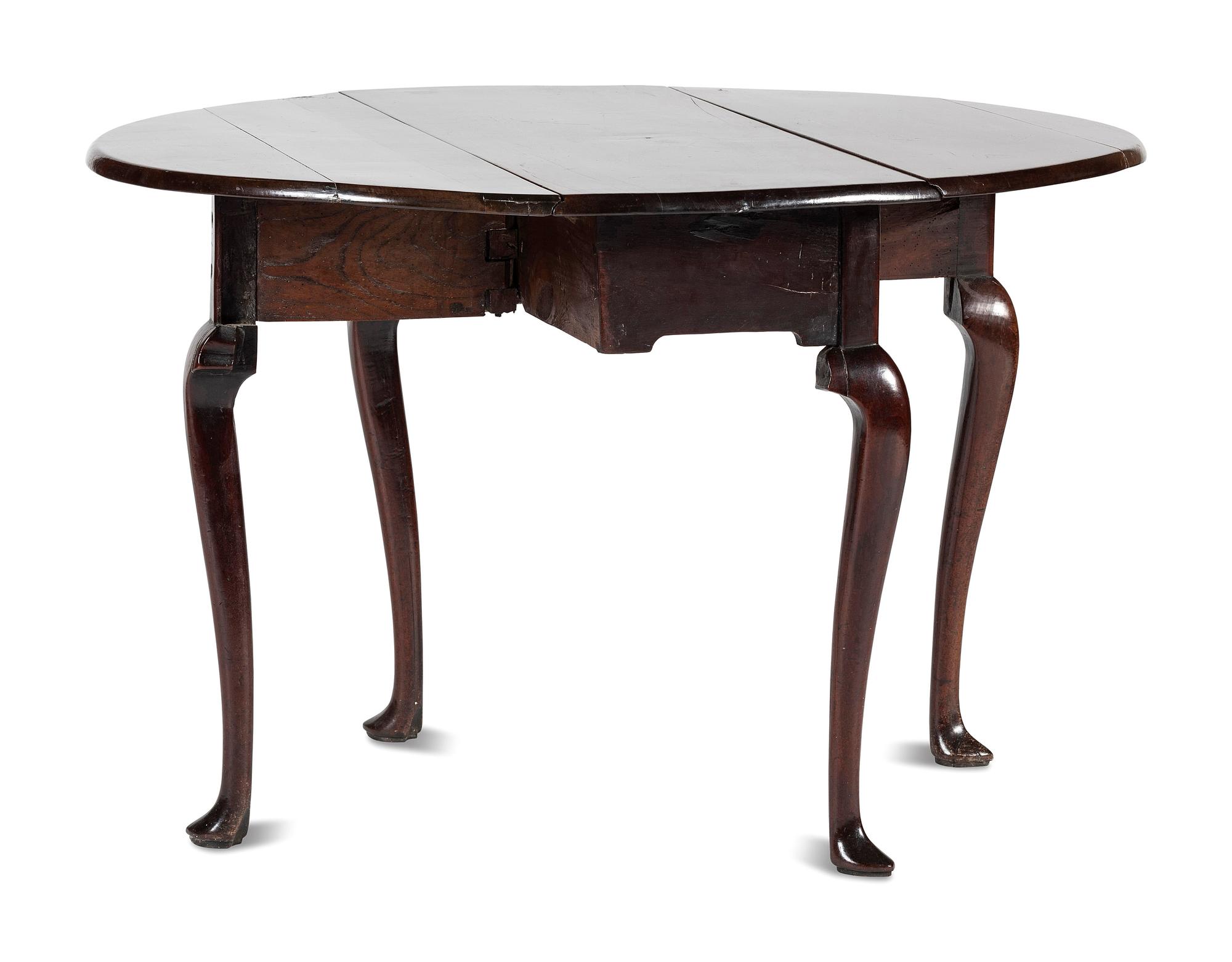 A Queen Anne Carved and Figured Mahogany Drop-Leaf Slipper Foot Table