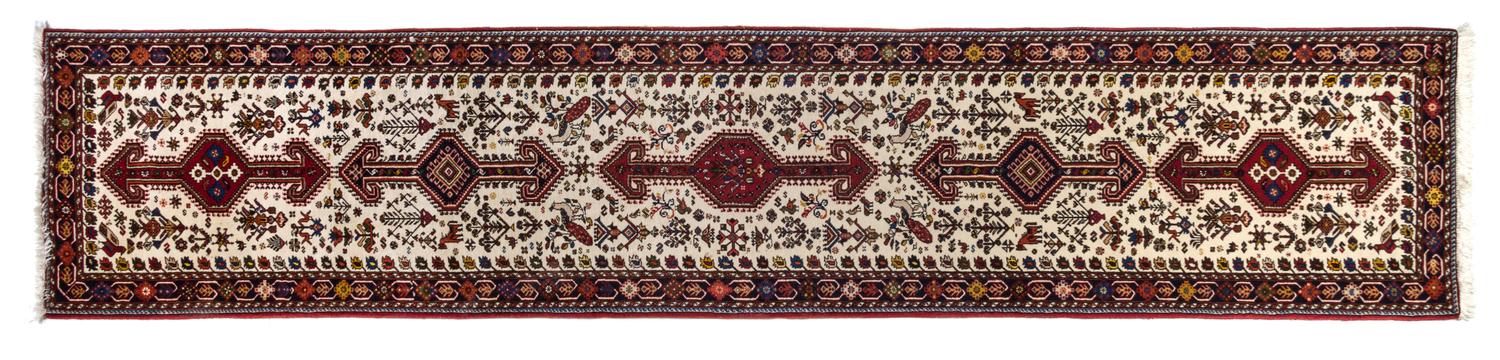 A Persian Wool Runner 13 feet 5 inches x 2 feet 10 inches.