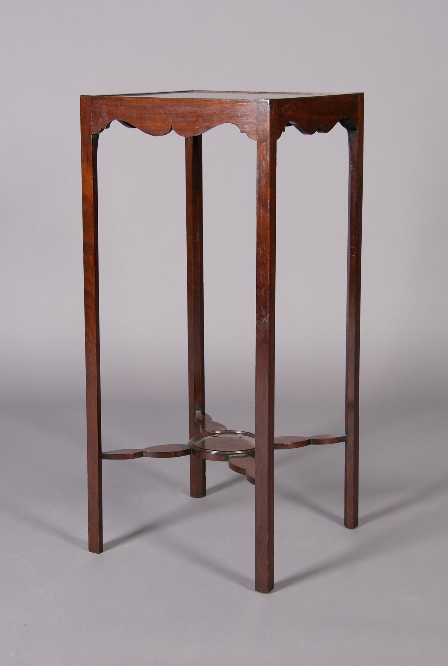 An English Mahogany Urn Stand, Height 31 3/4 x width 14 x depth 14 inches.
