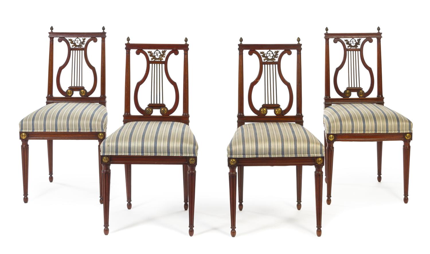 A Set of Four Louis XVI Style Brass Mounted Mahogany Lyre Back Chairs Height 36 3/4 inches.