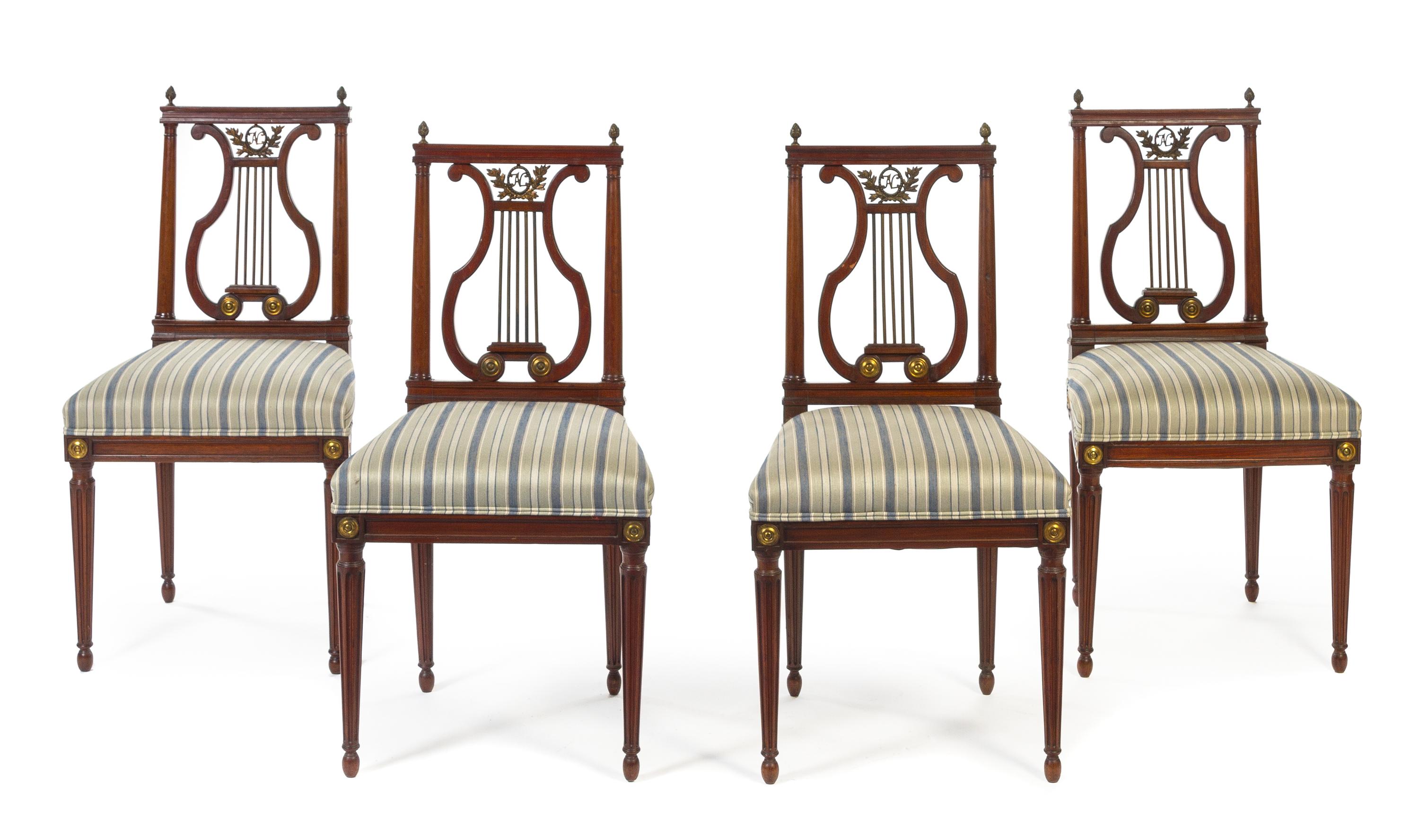 A Set of Four Louis XVI Style Brass Mounted Mahogany Lyre Back Chairs Height 36 3/4 inches.