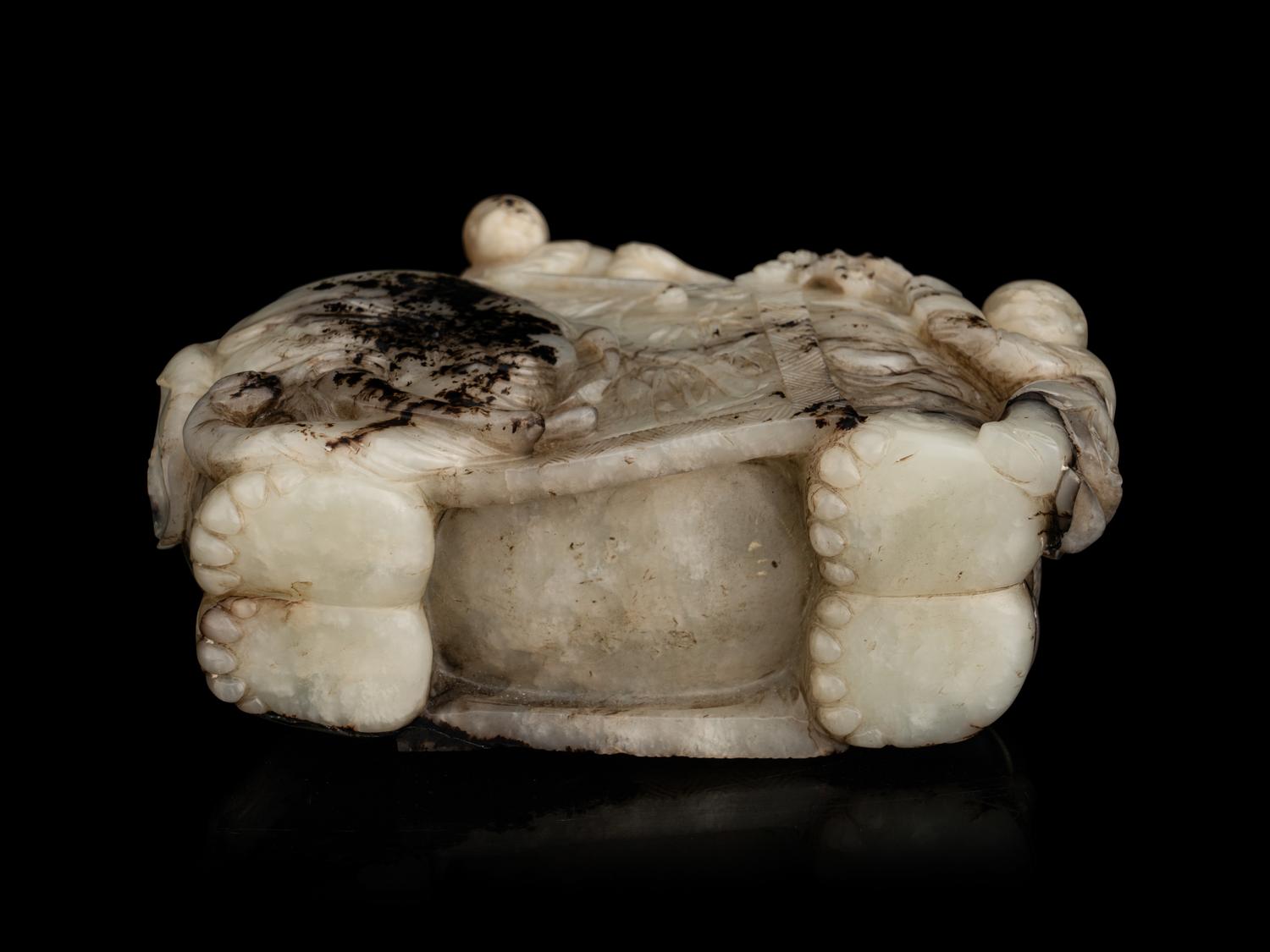 A Carved Jade ‘Elephant and Children’ Figural Group