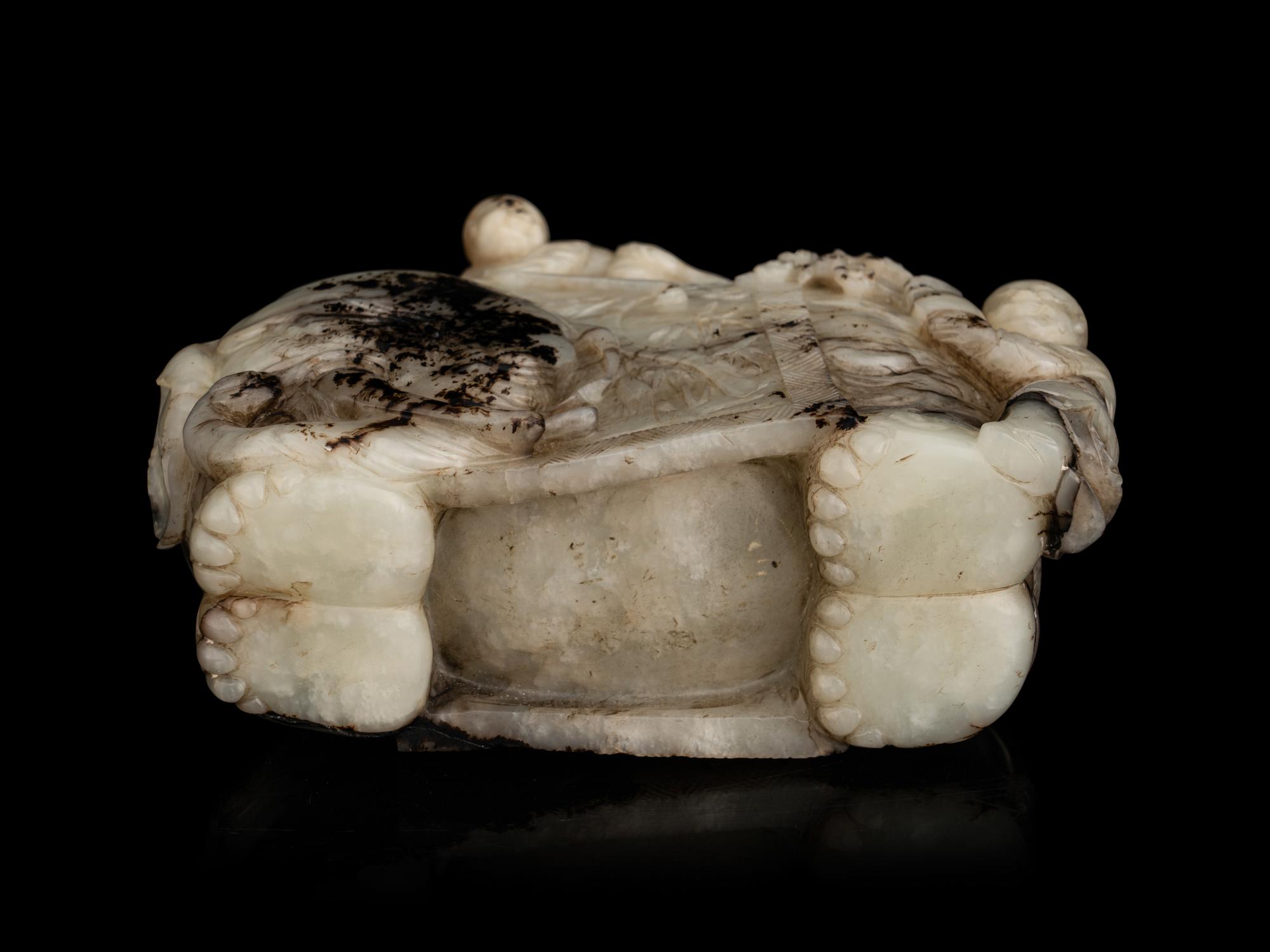 A Carved Jade ‘Elephant and Children’ Figural Group