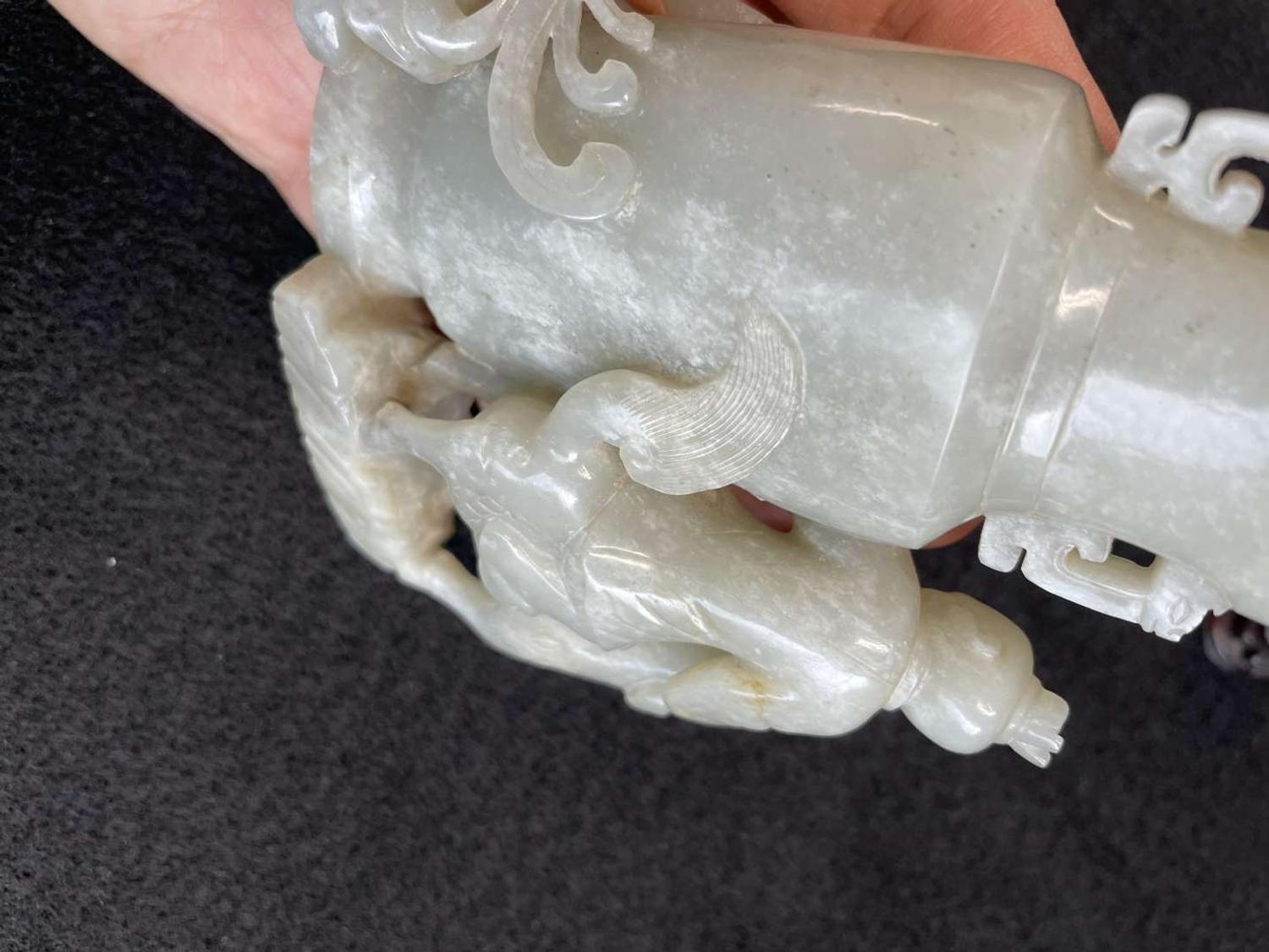 A Chinese jade "Boys, Kylin and Phoenix" vase on carved wood stand 玉雕童子凤鸟花樽及底座