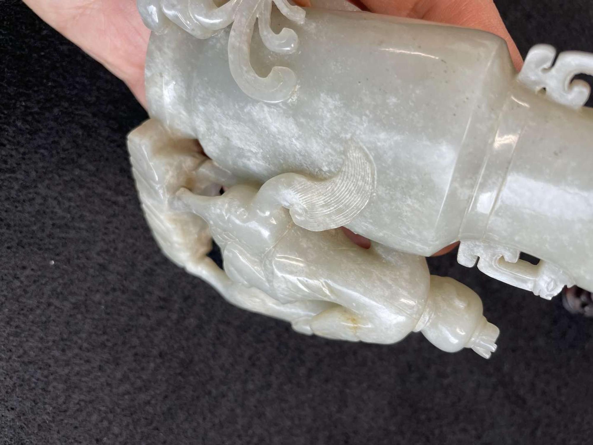 A Chinese jade "Boys, Kylin and Phoenix" vase on carved wood stand 玉雕童子凤鸟花樽及底座