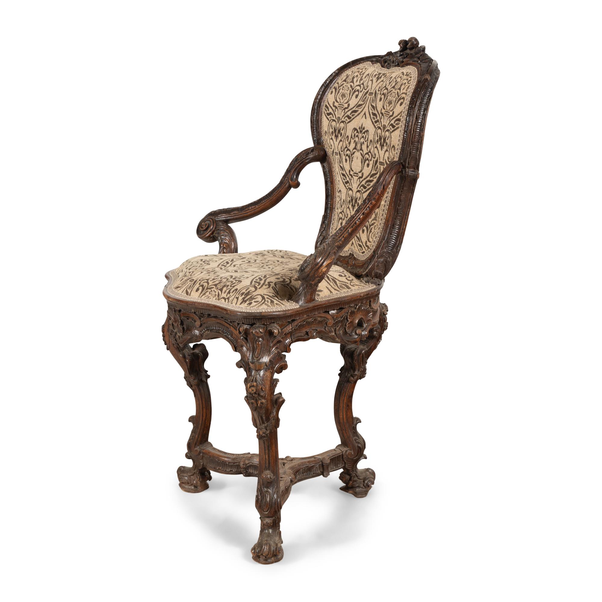 A Venetian Carved Walnut Armchair