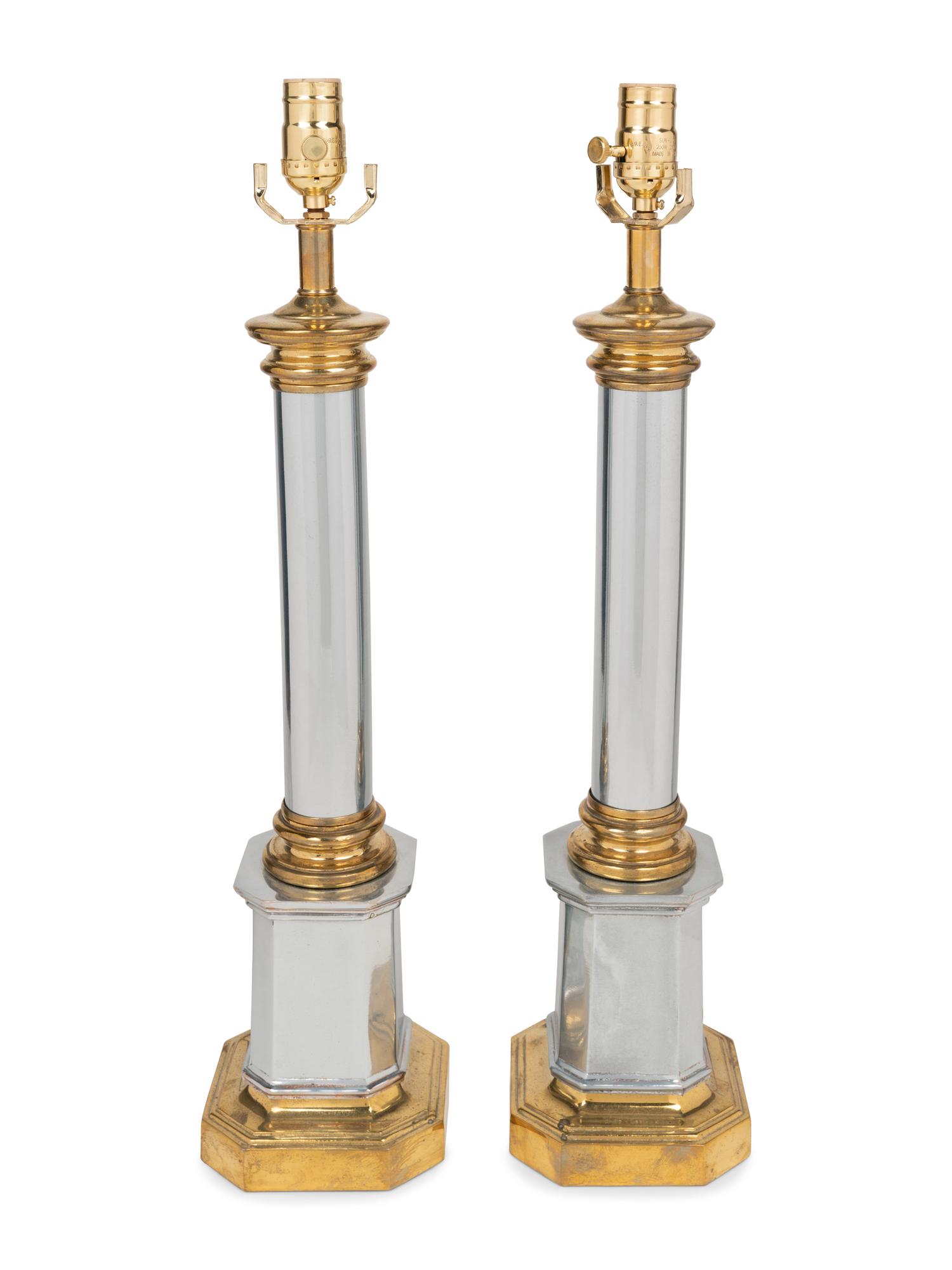 A Pair of Brass and Steel Columnar Lamps