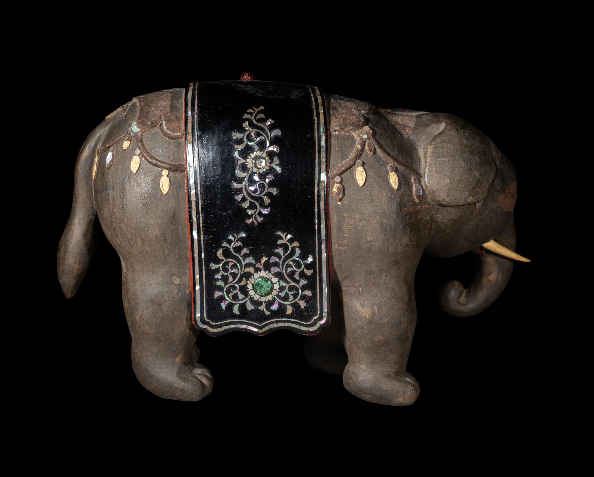 A Japanese Mother-of-Pearl Inlaid Lacquered Wood Okimono of an Elephant