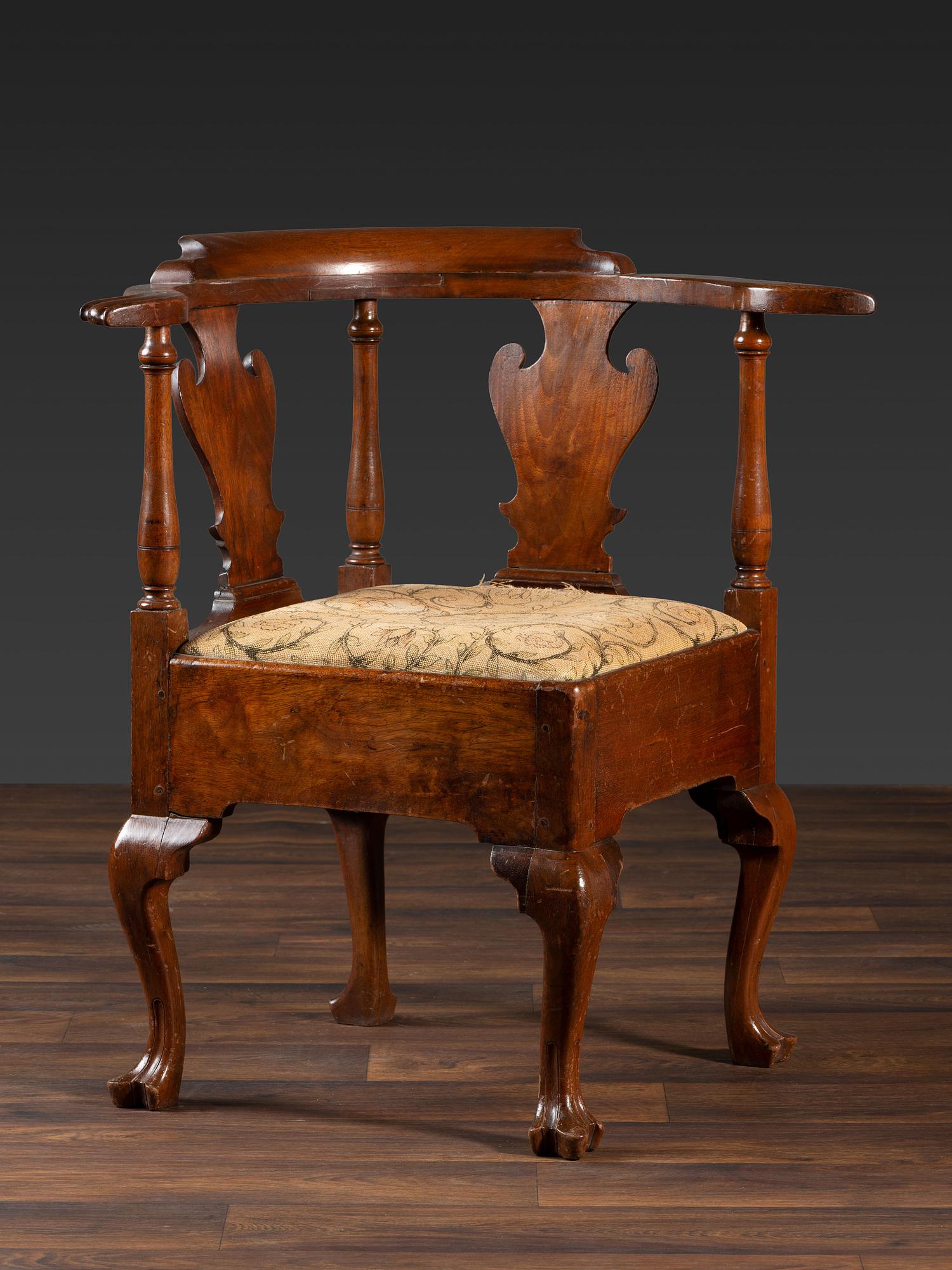A Queen Anne Carved Walnut Knuckle-Arm and Trifid Foot Corner Chair