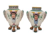 A Pair of Italian Glazed Ceramic Urns Decorated with Horned Masks and Paw Feet