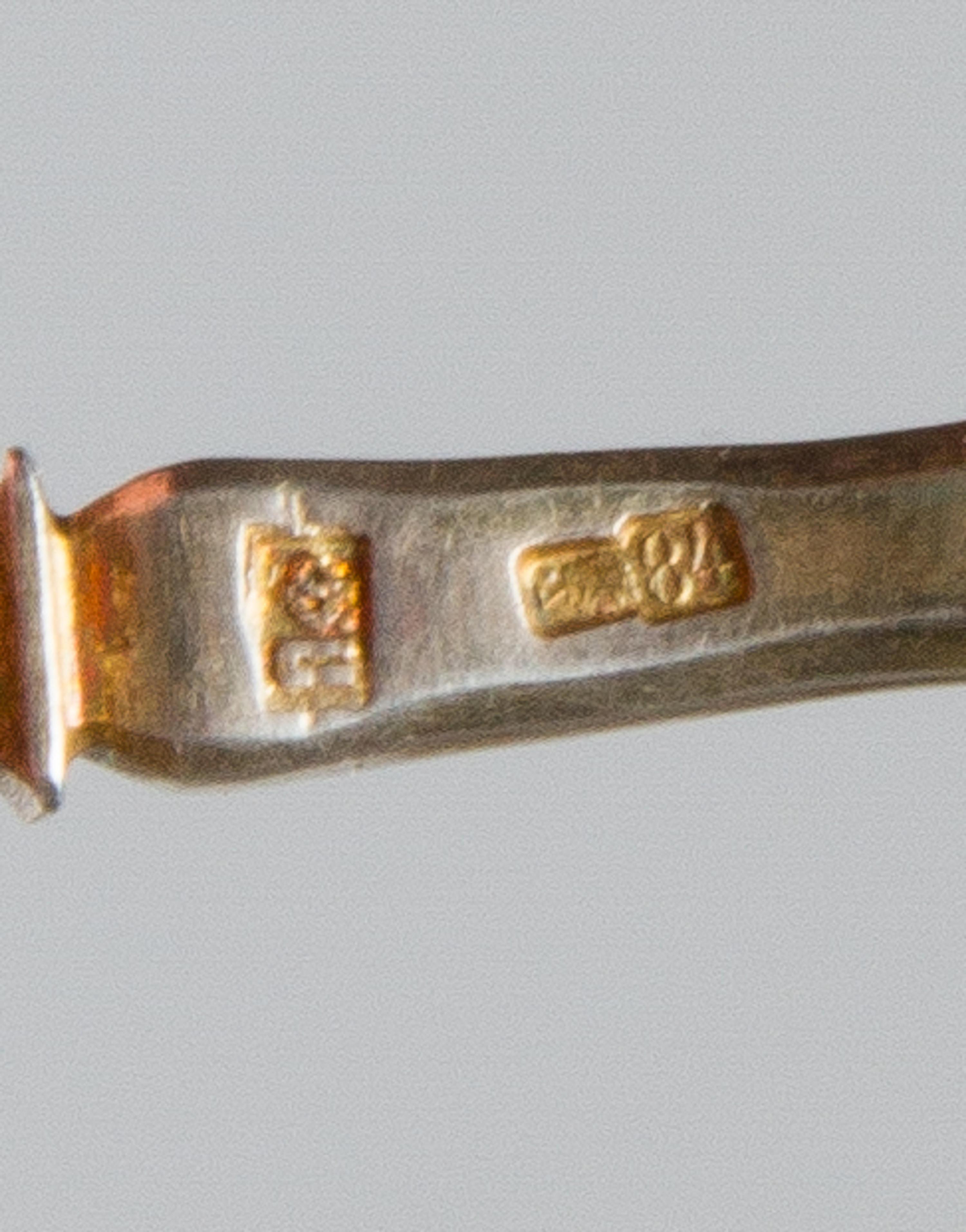 A Russian Silver-Gilt and Enamel Spoon, Maker's mark likely Pitor Fariseyev, Moscow, early 20th century, having an enamel and twist dec