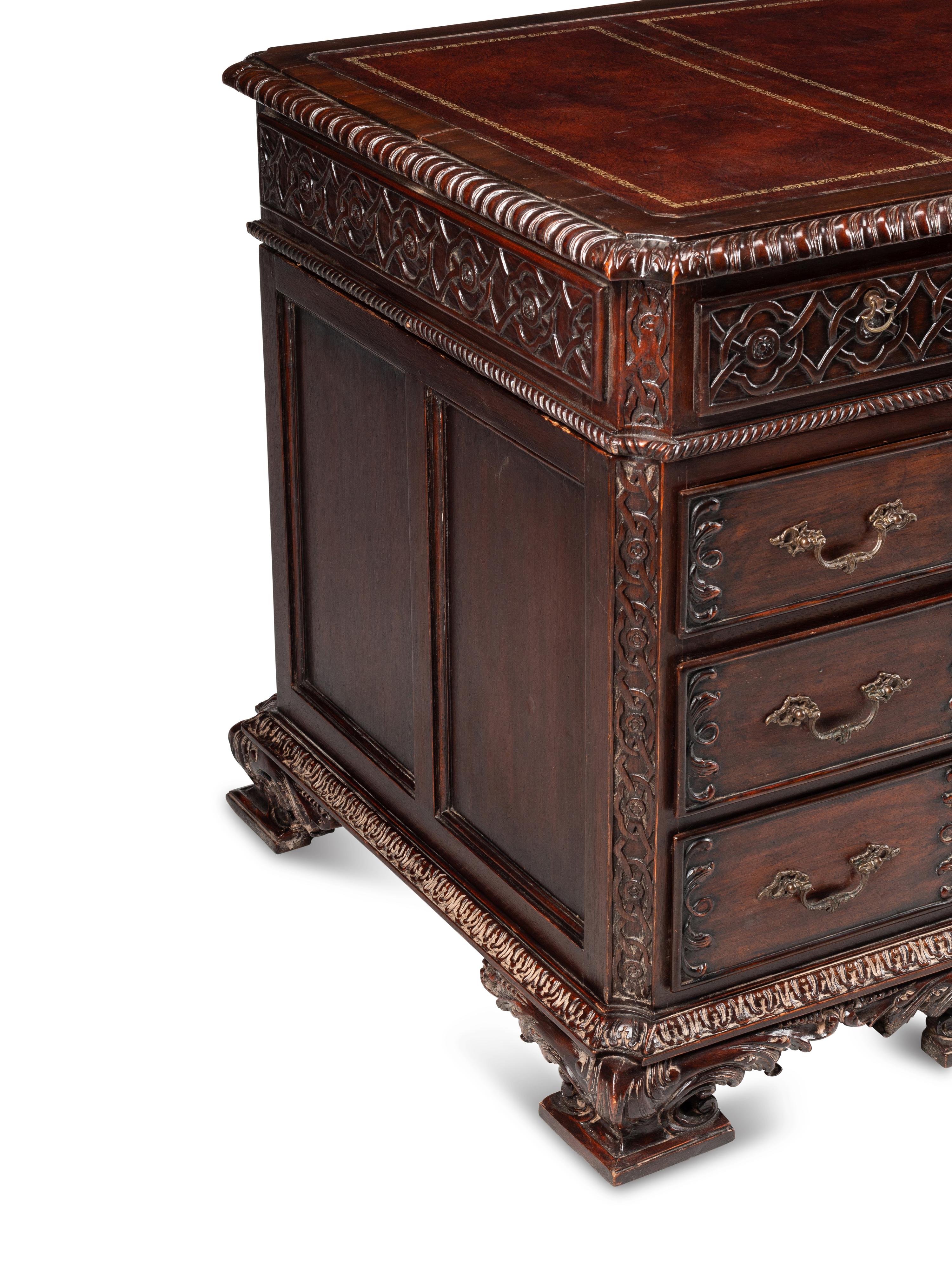 A George III Style Carved Mahogany Pedestal Desk
