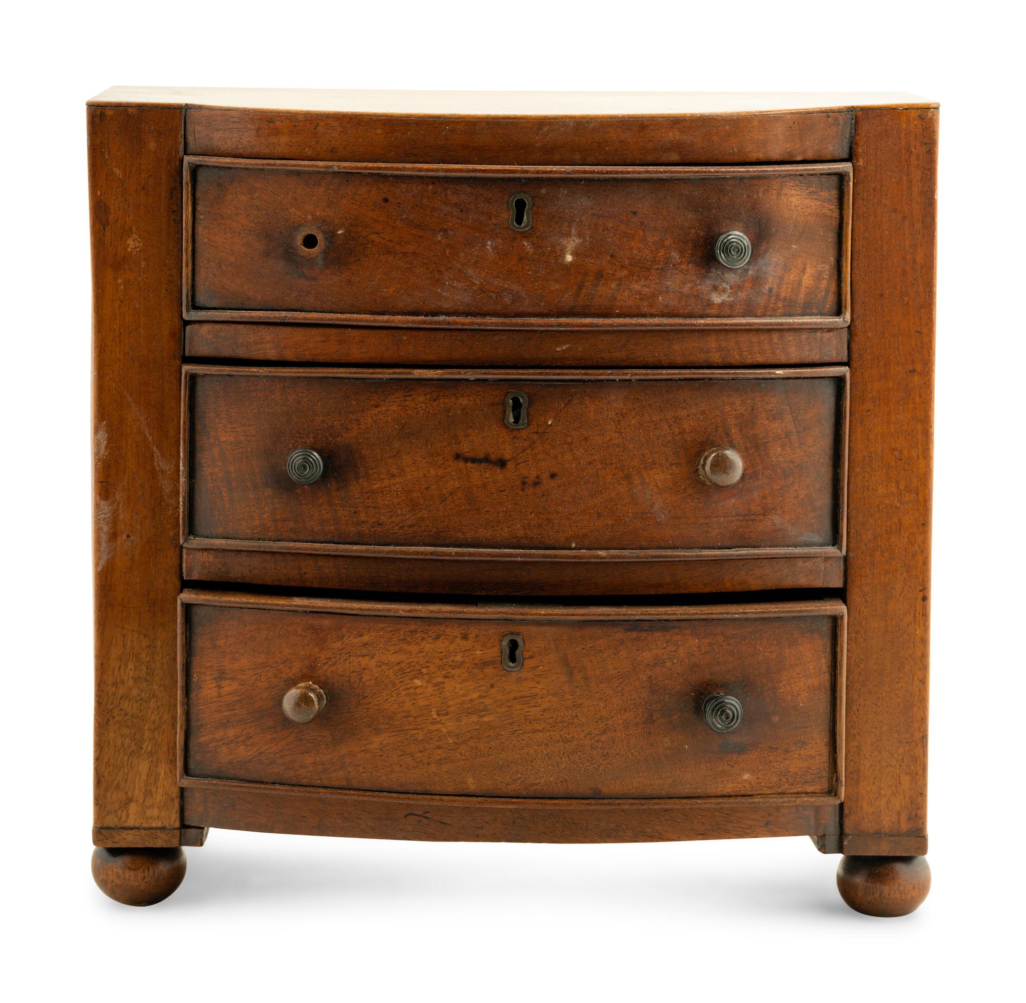 A Regency Mahogany Diminutive Bowfront Chest of Drawers