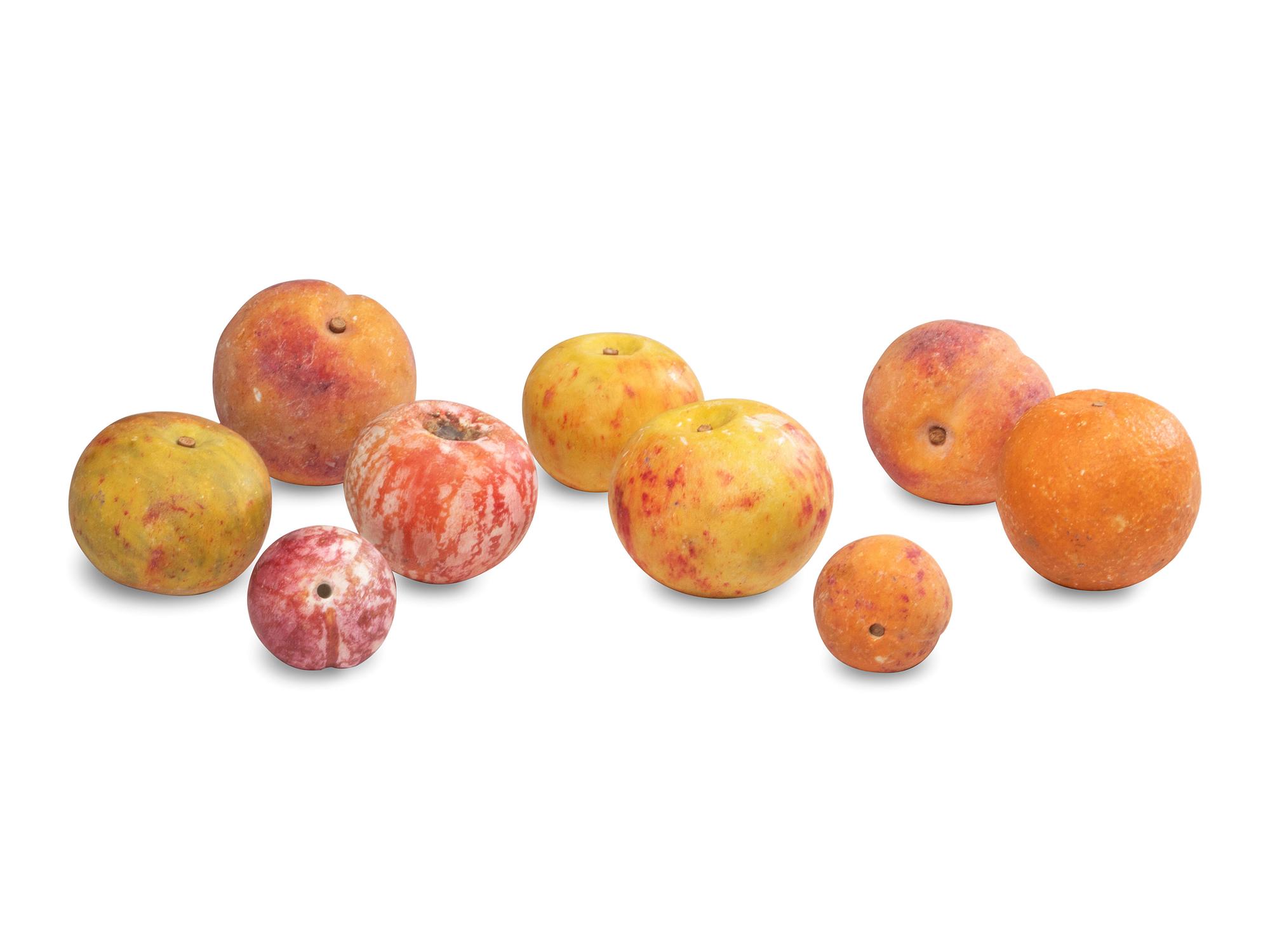 A Group of Carved and Painted Stone Fruit