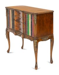 A Louis XV Style Walnut and Leather Faux Book-Front Cabinet