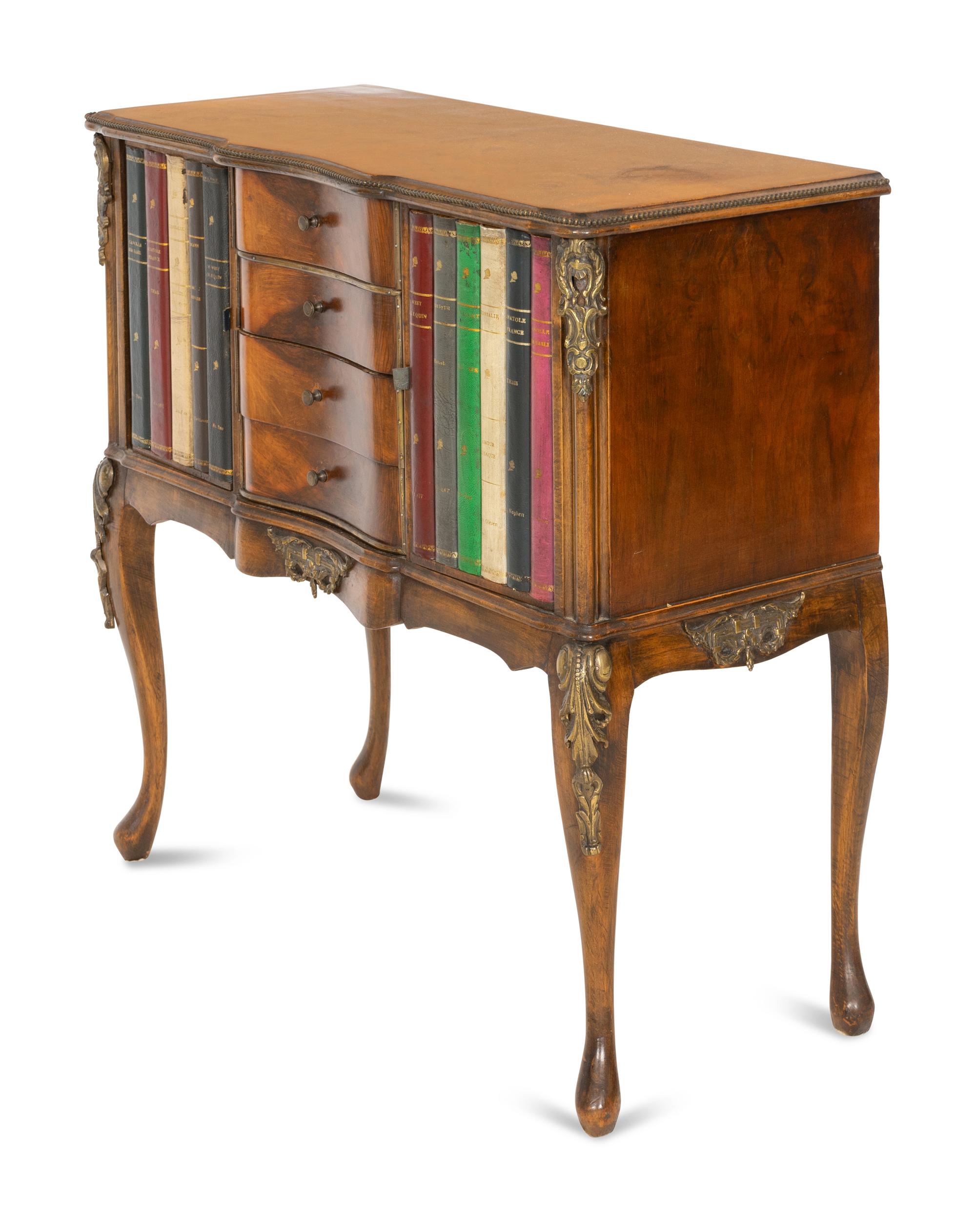 A Louis XV Style Walnut and Leather Faux Book-Front Cabinet