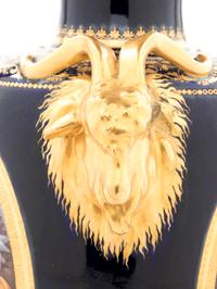 A Pair of Vienna Painted and Parcel Gilt Handled Porcelain Urns