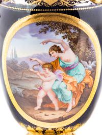 A Pair of Vienna Painted and Parcel Gilt Handled Porcelain Urns