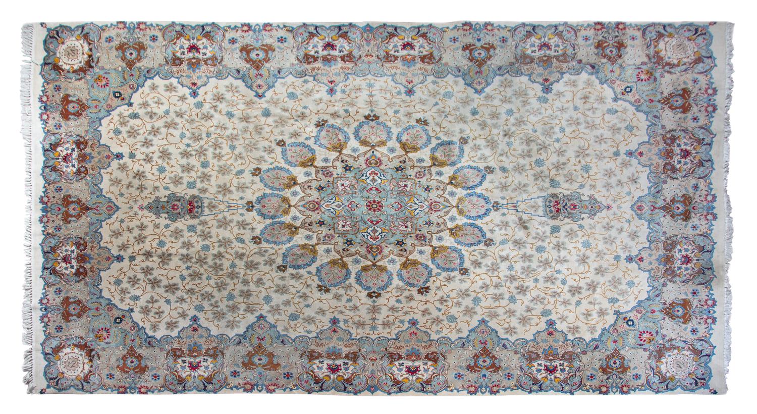 A Tabriz Wool Rug 15 feet 8 inches x 9 feet 9 1/2 inches.
