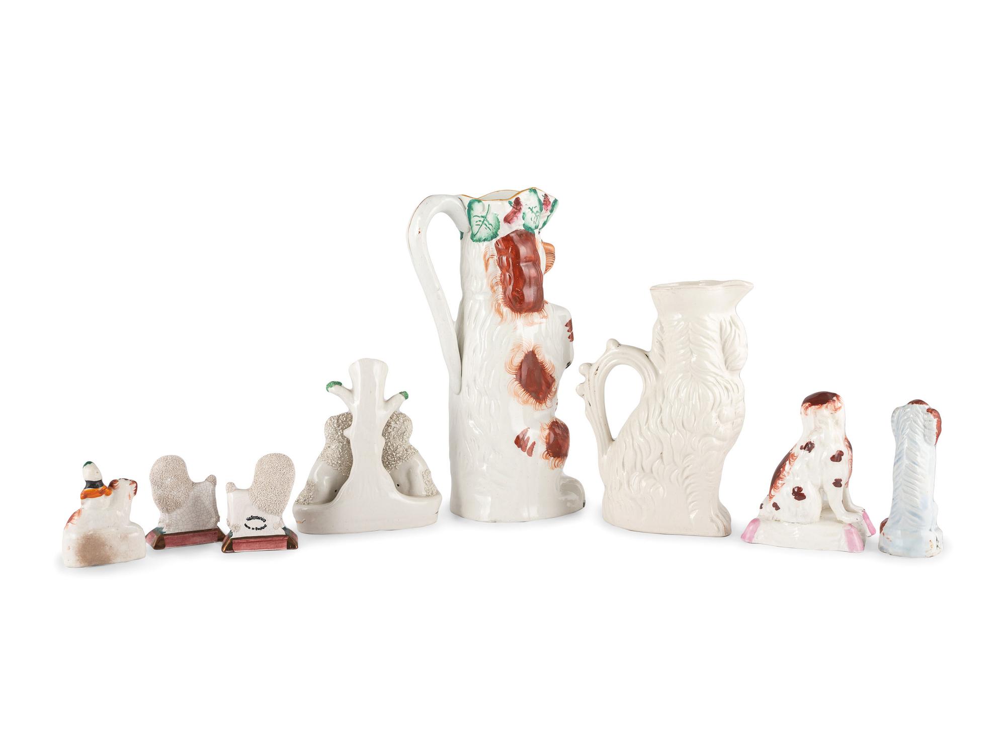 Eight Staffordshire Glazed Earthenware Dogs