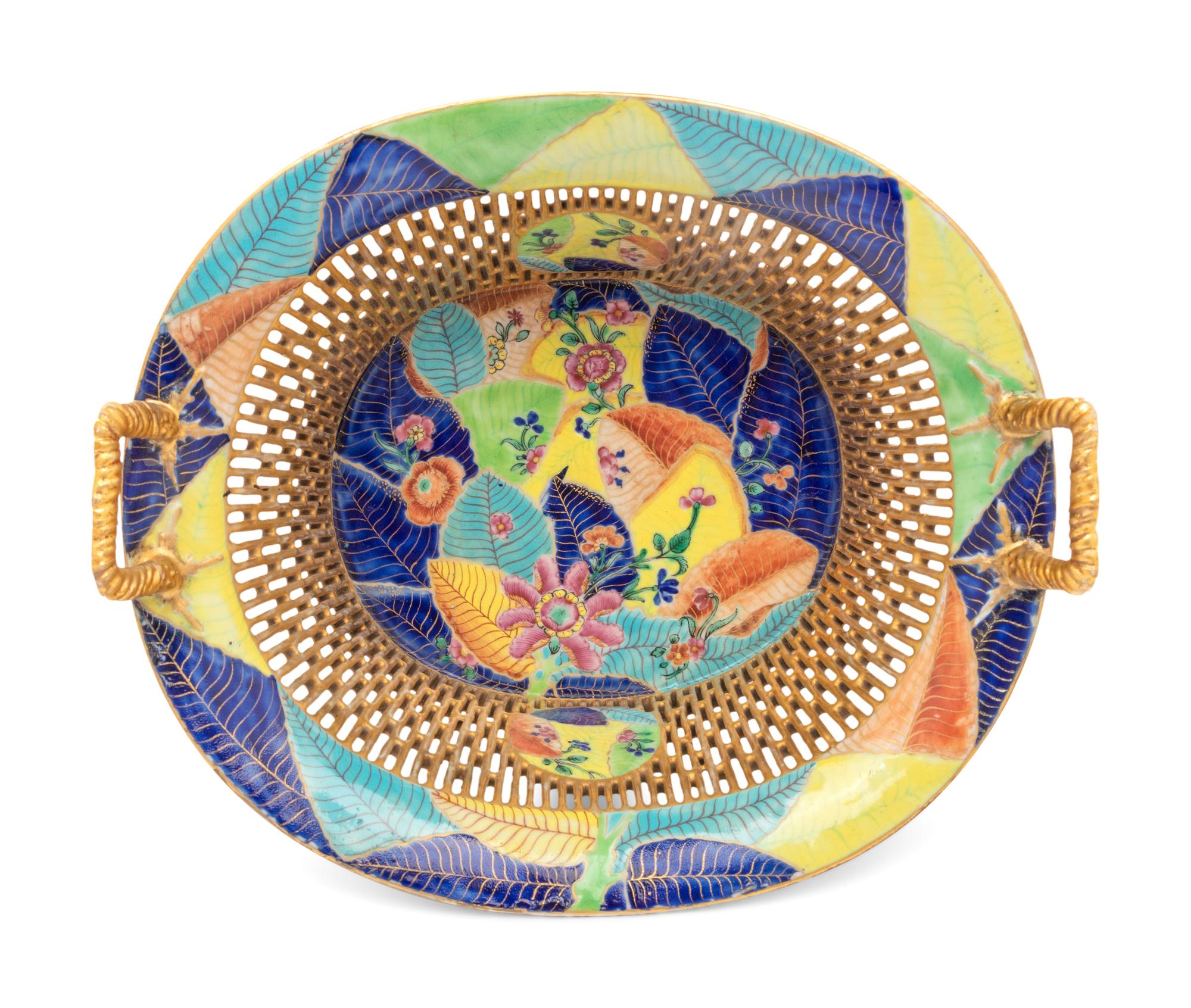 A Chinese Export Tobacco Leaf Reticulated Porcelain Basket and Underplate