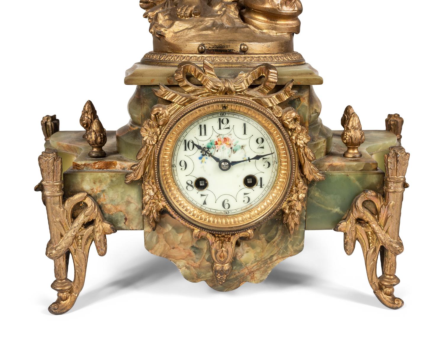 A Neoclassical Gilt Metal and Onyx Clock Garniture