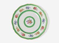 An English Floral Decorated and Parcel Gilt Creamware Dinner Service