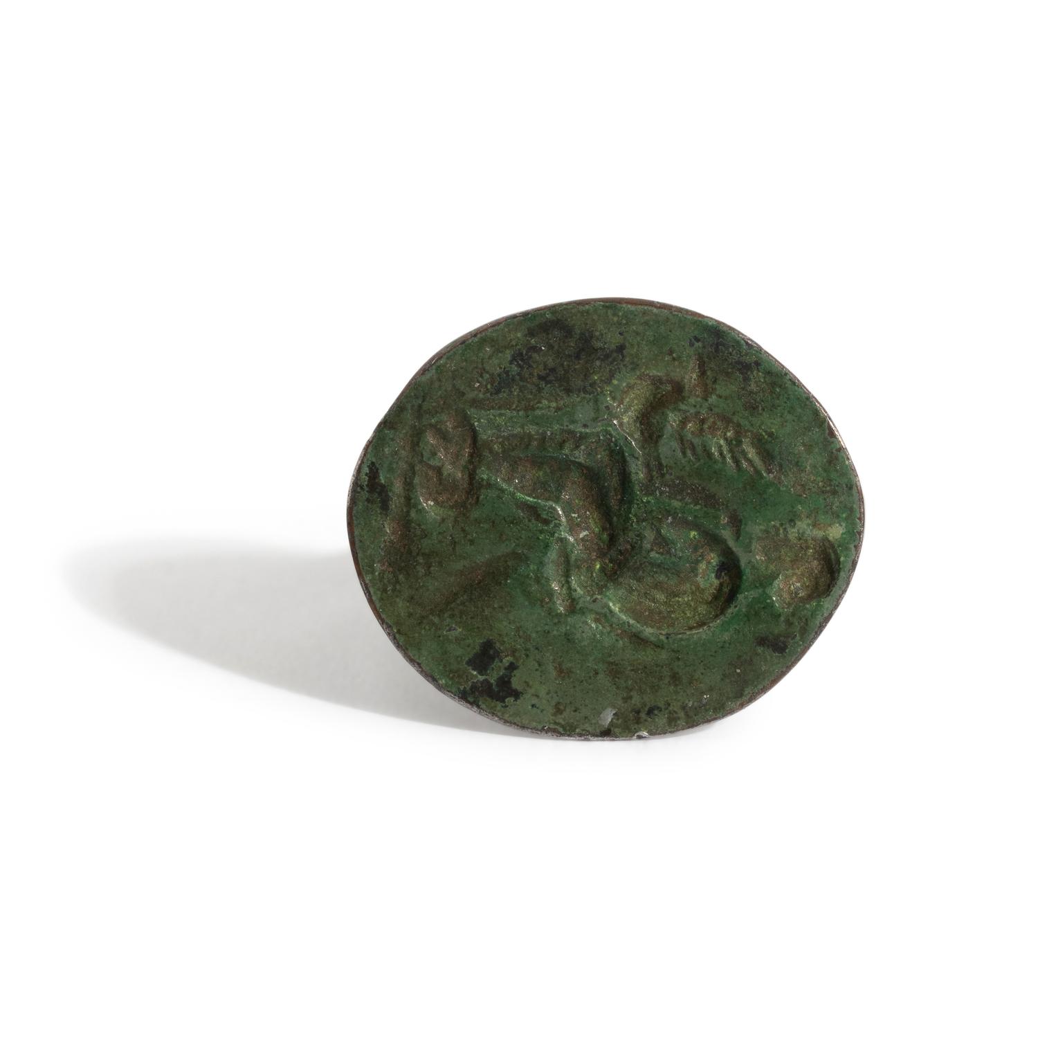 A Greek Bronze Finger Ring with Leda and the Swan or Aphrodite and her Dove
