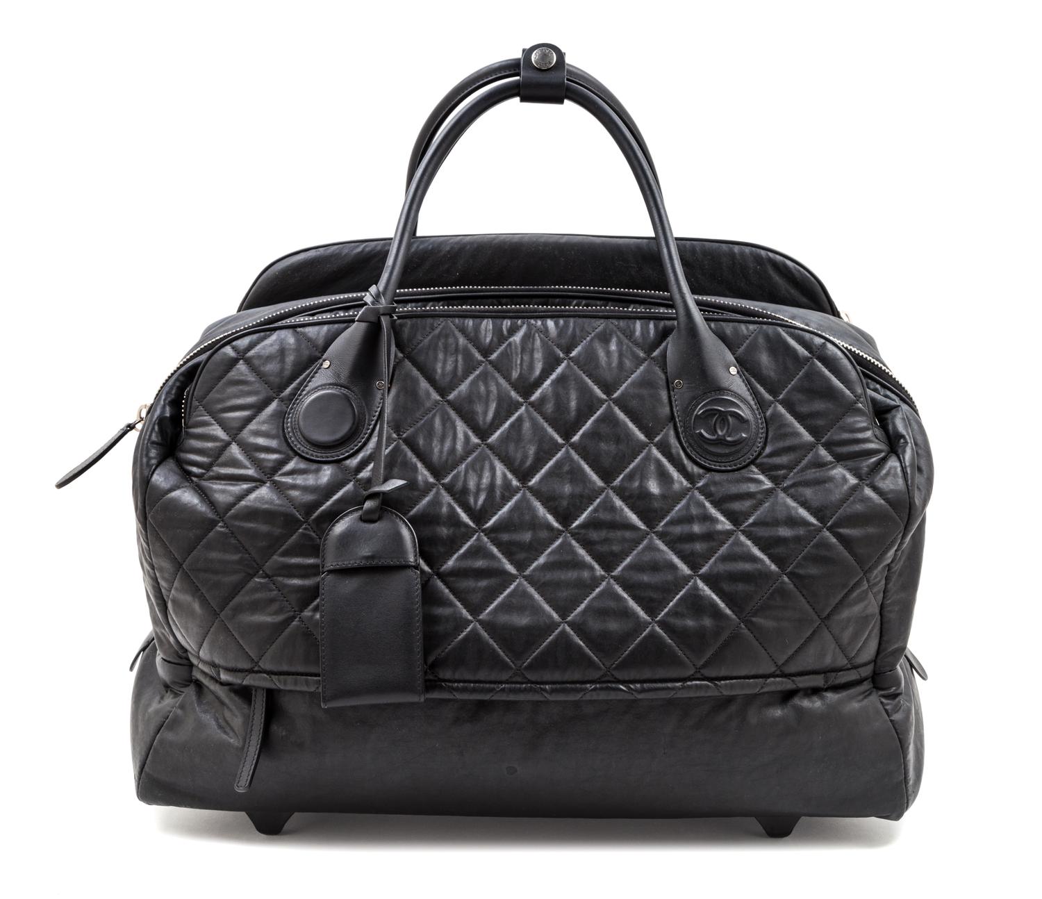 A Chanel Black Quilted Weekender Roller Bag, 19" x 13.5" x 8.5"; Top handle 7''.