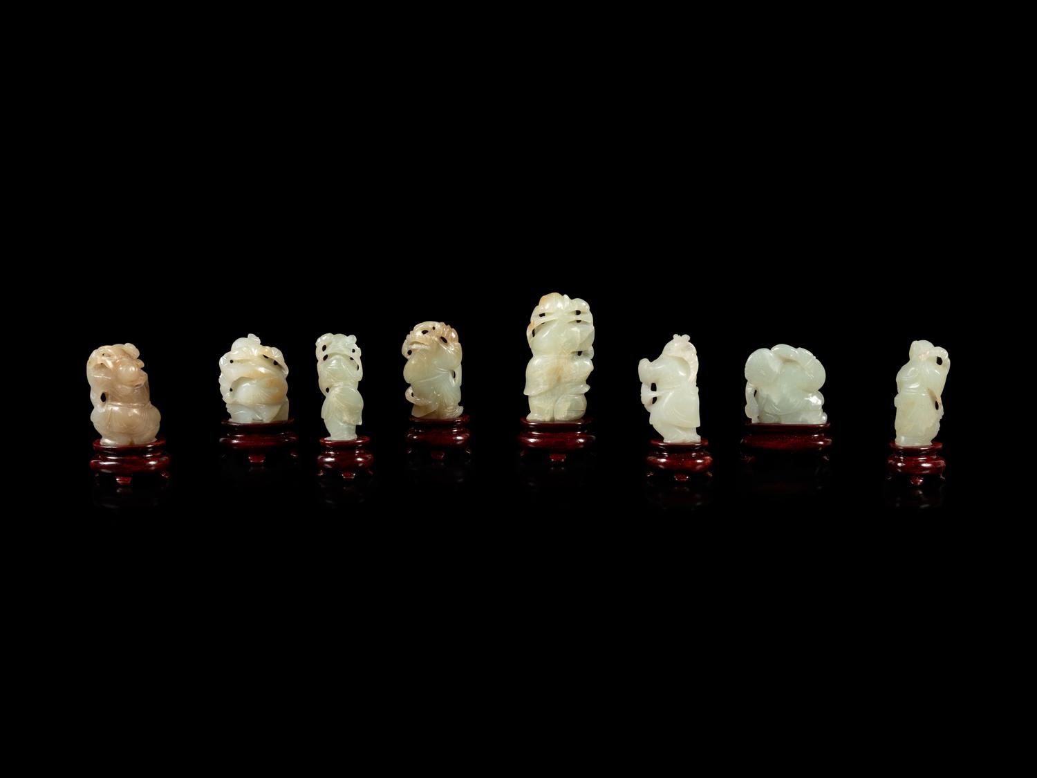 Eight Chinese Celadon Jade Figures of Boys