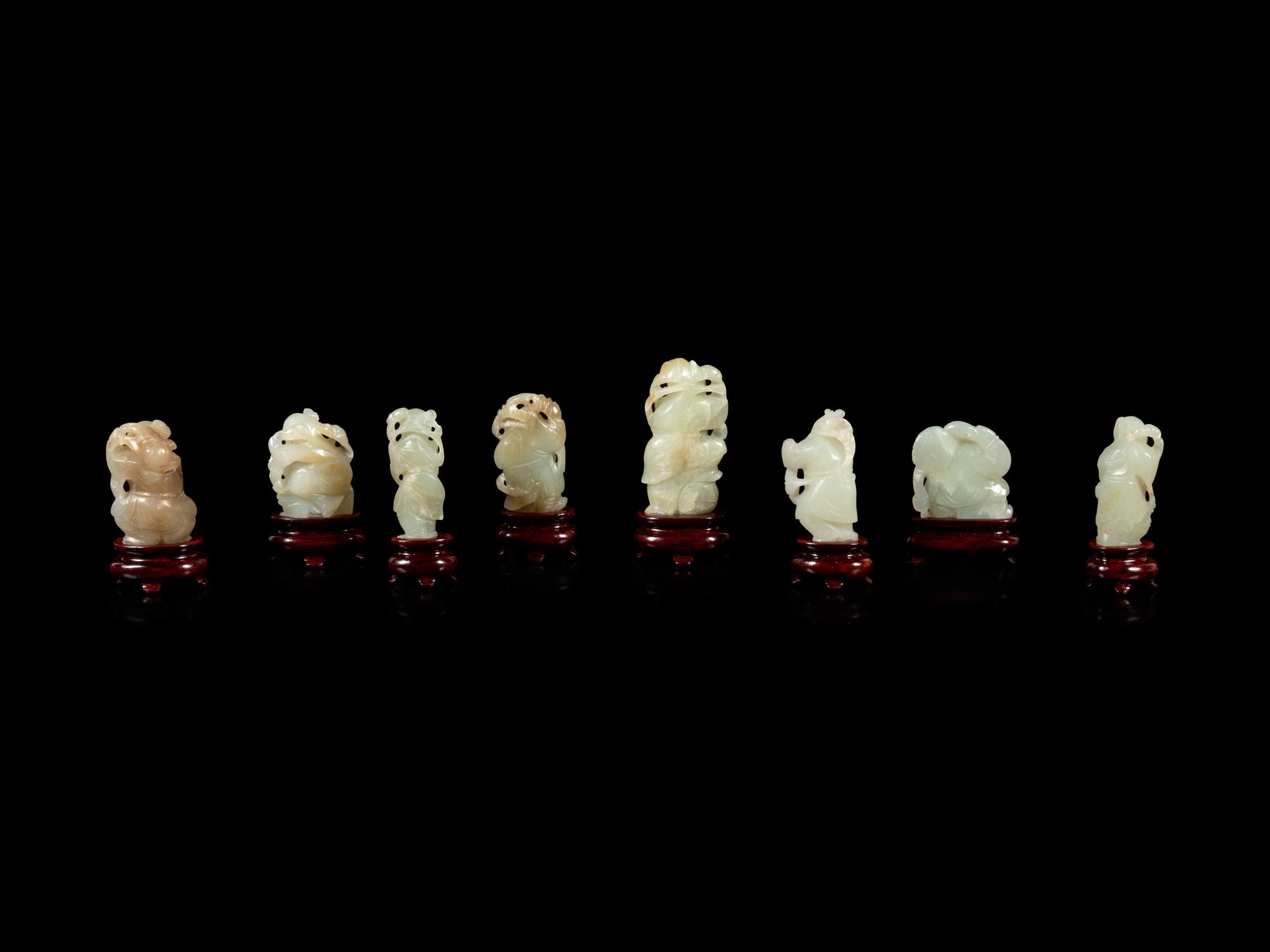 Eight Chinese Celadon Jade Figures of Boys