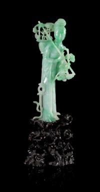 An Apple Green and Celadon Jadeite Figure of a Meiren Height 7 inches.