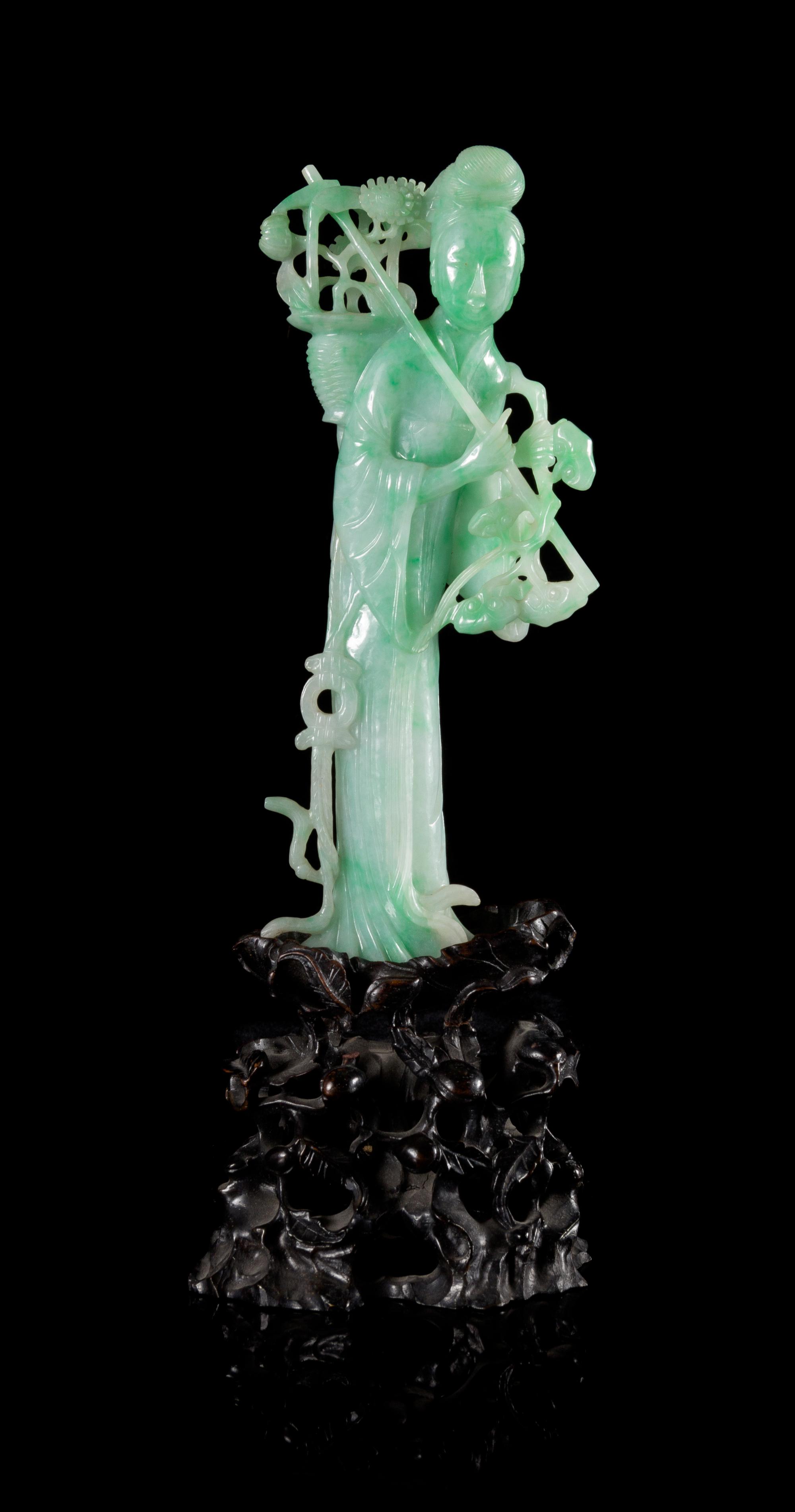 An Apple Green and Celadon Jadeite Figure of a Meiren Height 7 inches.