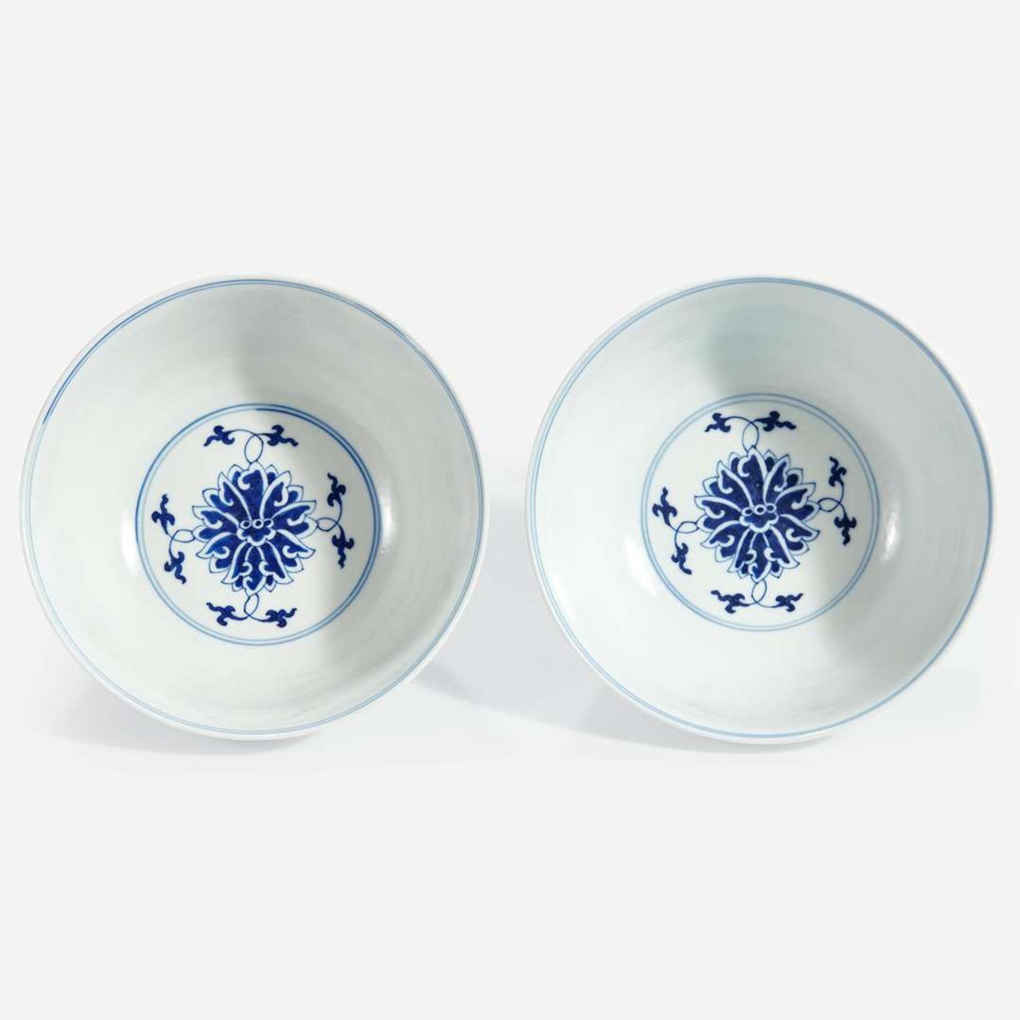 An associated pair of Chinese blue and white porcelain "Lotus" bowls Guangxu six-character marks