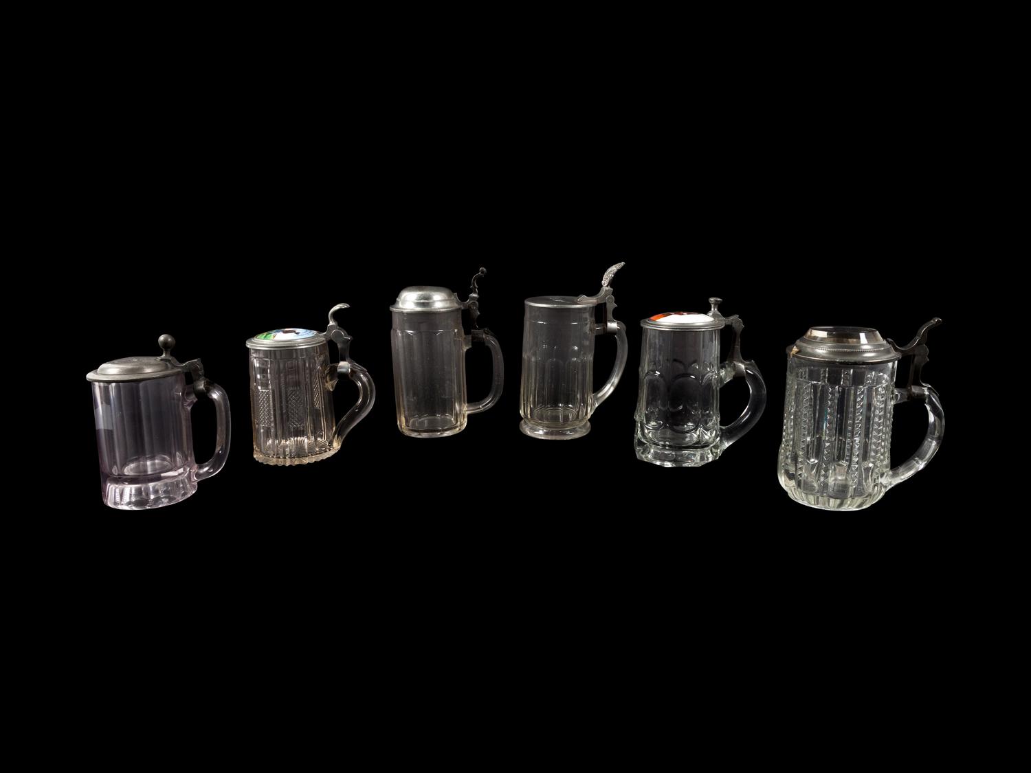 A Collection of Steins and a Large Pitcher