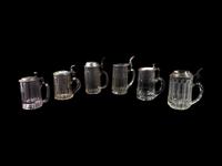 A Collection of Steins and a Large Pitcher