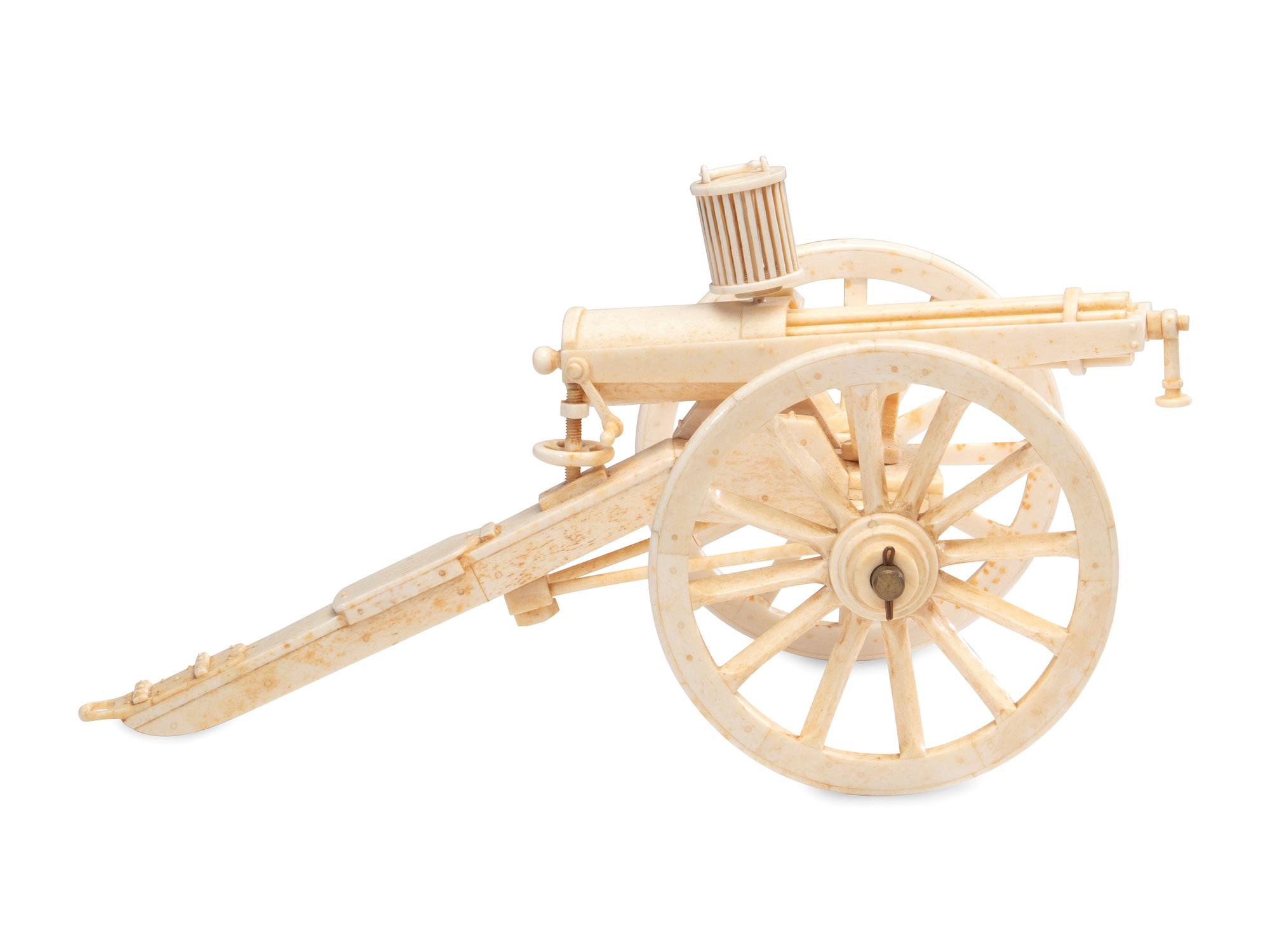 A Carved Walrus Ivory and Bone Gatling Gun Model