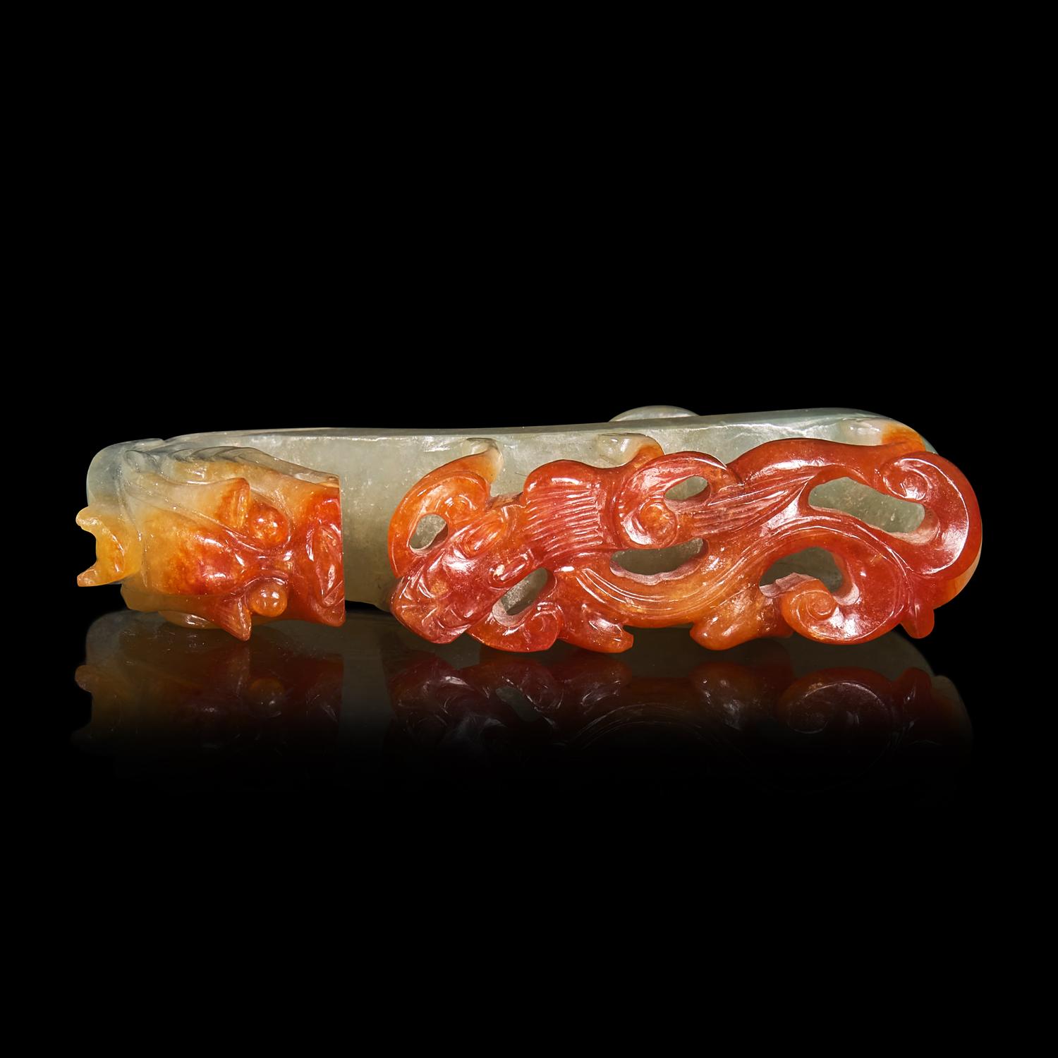 A Chinese Russet and Pale Celadon Jadeite "Dragons" Belthook 翡翠龍紋帶鉤