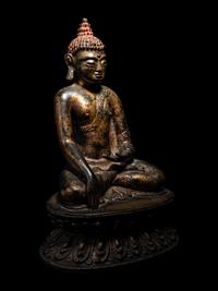 A Large Nepalese Gilt Bronze Figure of Seated Buddha