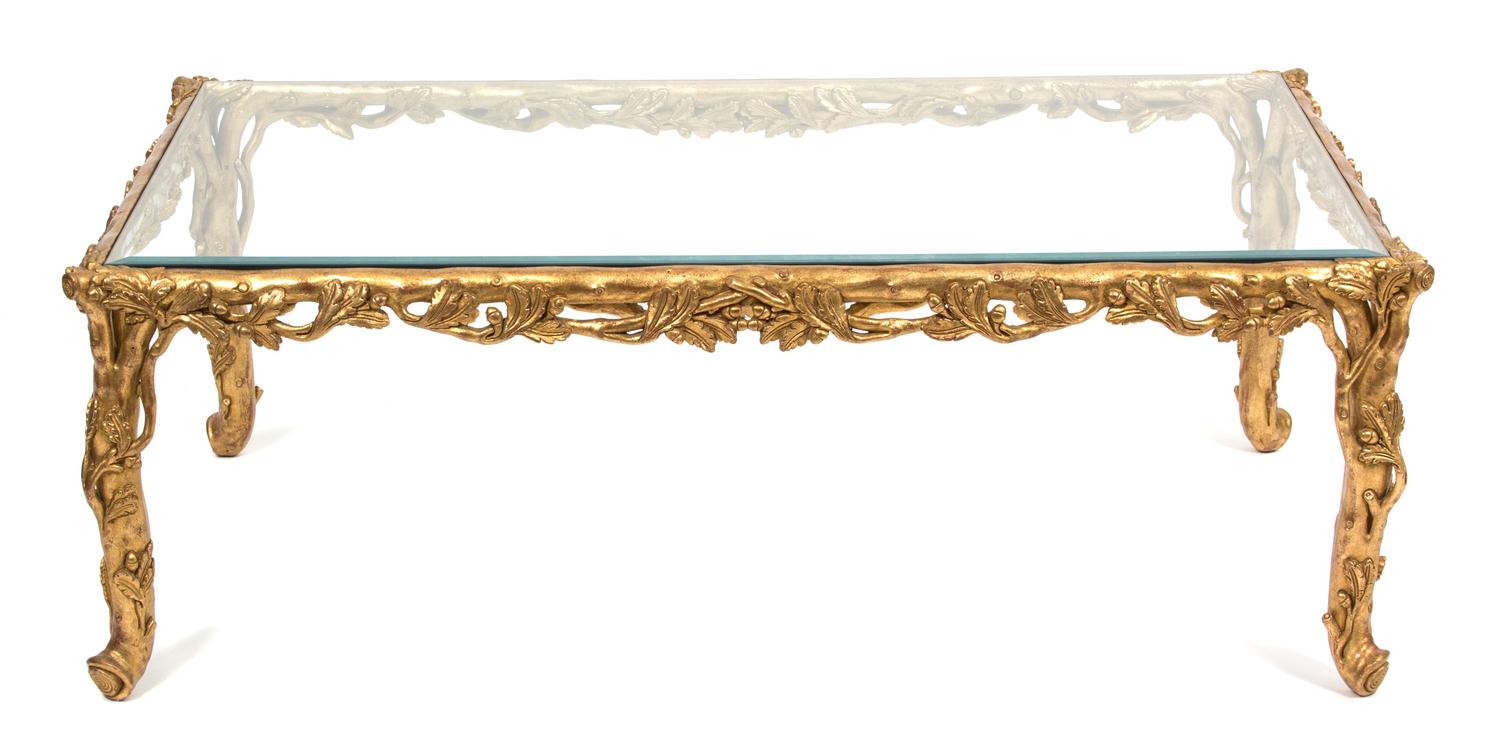 A Carved Giltwood Rectangular Glass Top Table Height 17 1/2 x width 50 3/4 x depth 31 inches. — 20TH CENTURY