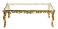 A Carved Giltwood Rectangular Glass Top Table Height 17 1/2 x width 50 3/4 x depth 31 inches. — 20TH CENTURY