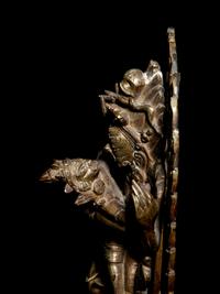 A Tibetan Gilt Bronze Figure of Mahakala and Consort