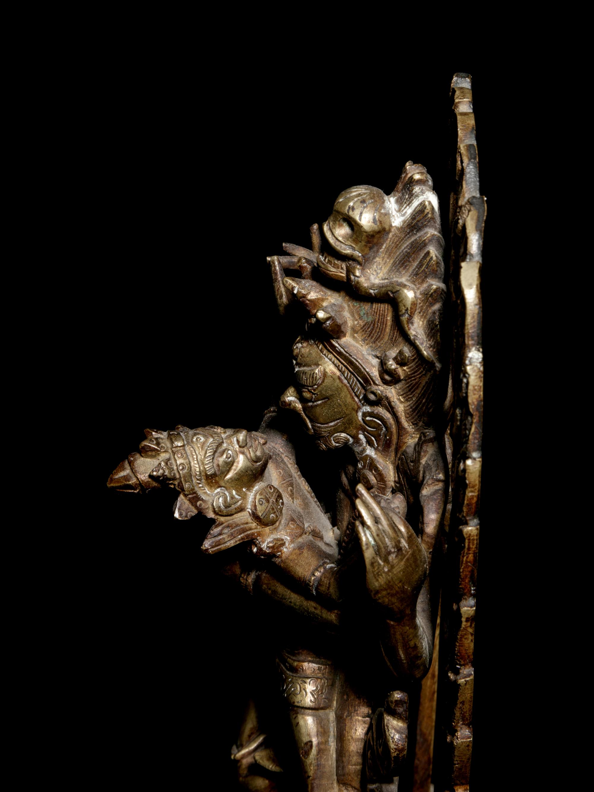 A Tibetan Gilt Bronze Figure of Mahakala and Consort
