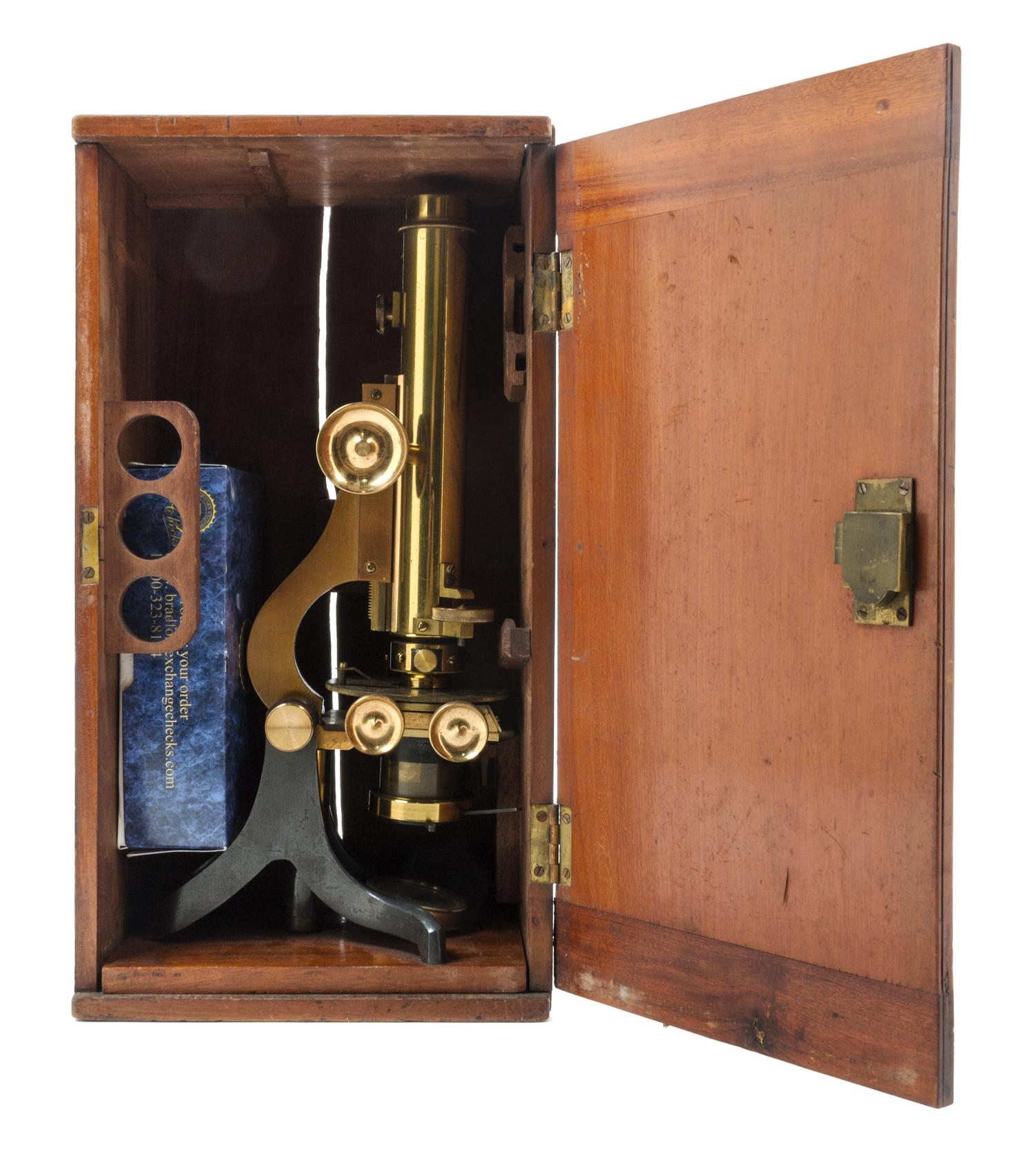 An English Brass and Black Lacquered Binocular Microscope Height 13 1/4 inches. — LOFTUS, LONDON, EARLY 20TH CENTURY