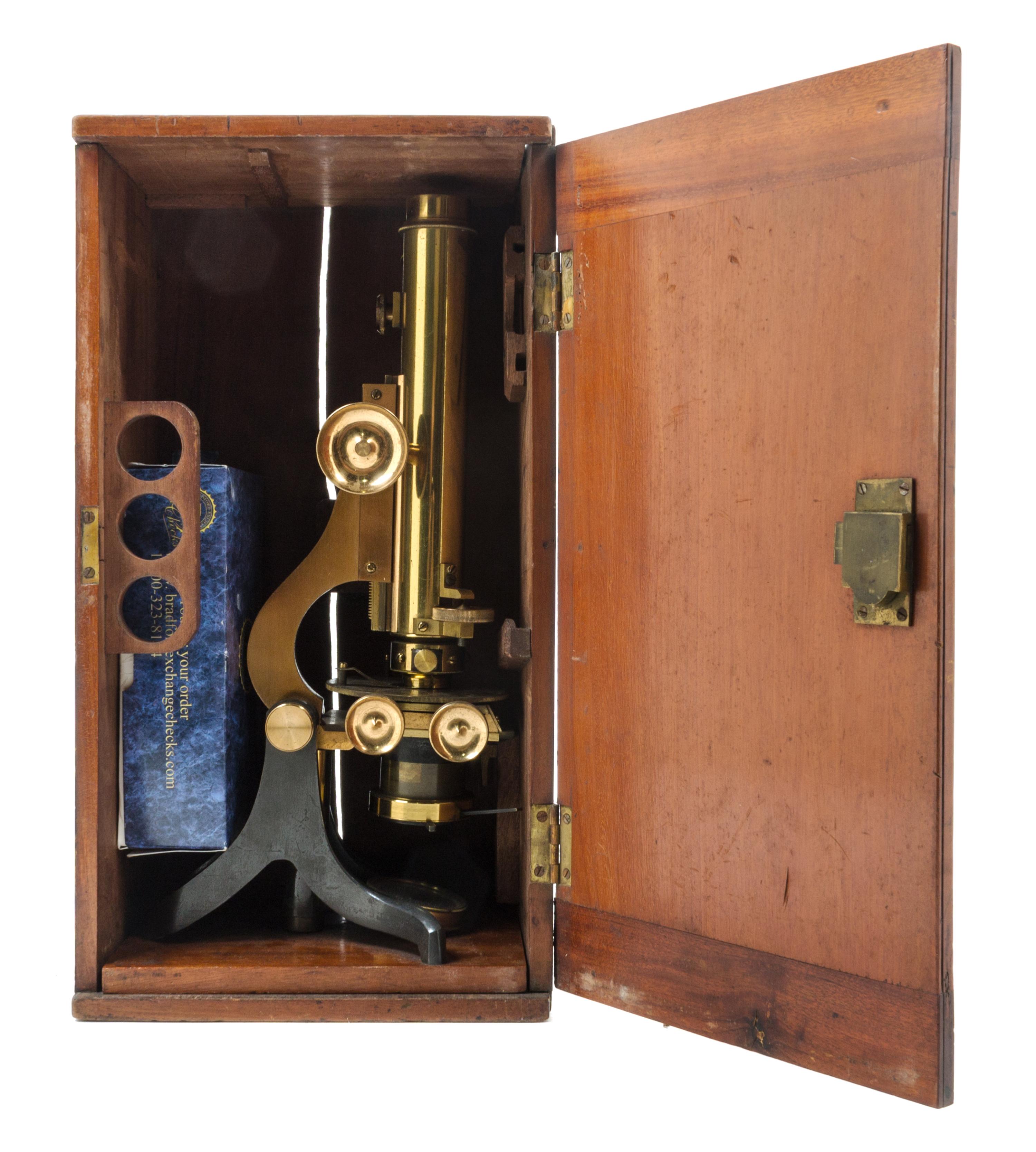 An English Brass and Black Lacquered Binocular Microscope Height 13 1/4 inches. — LOFTUS, LONDON, EARLY 20TH CENTURY