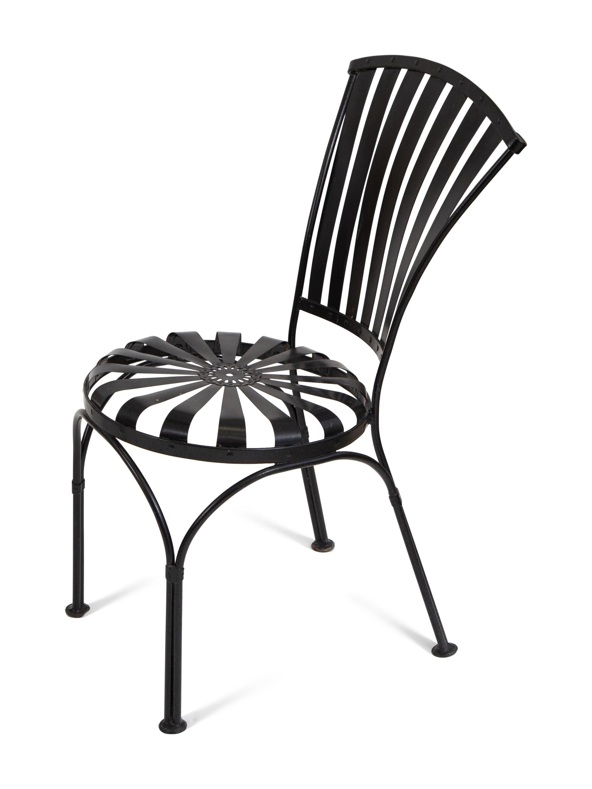 A Spring Steel Garden Table and Eight Chairs by Francois Carre