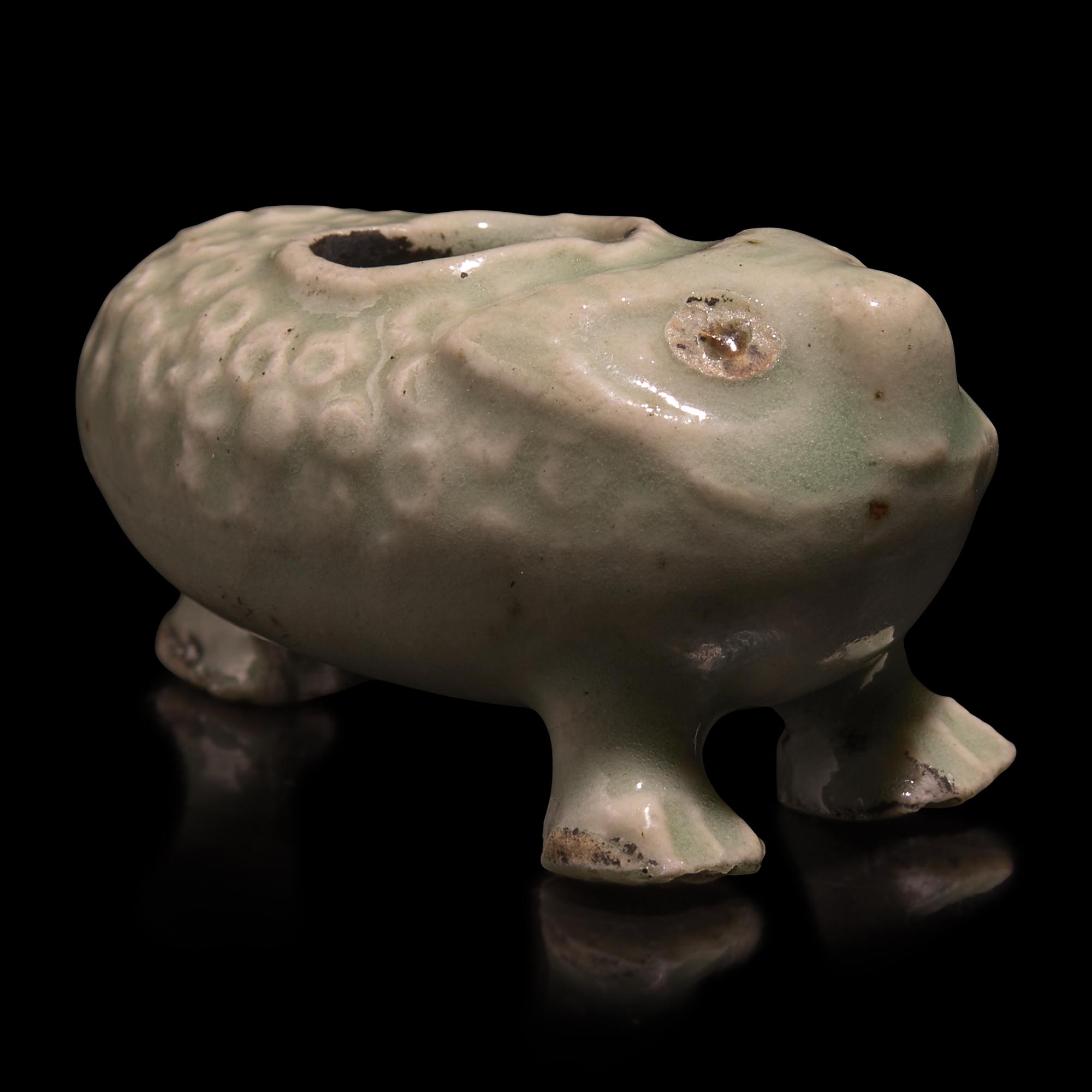 A Chinese Pale Blue Glazed Three-Legged Toad, Yuan/Ming Dynasty or Earlier — 元明或更早 青釉金蟾